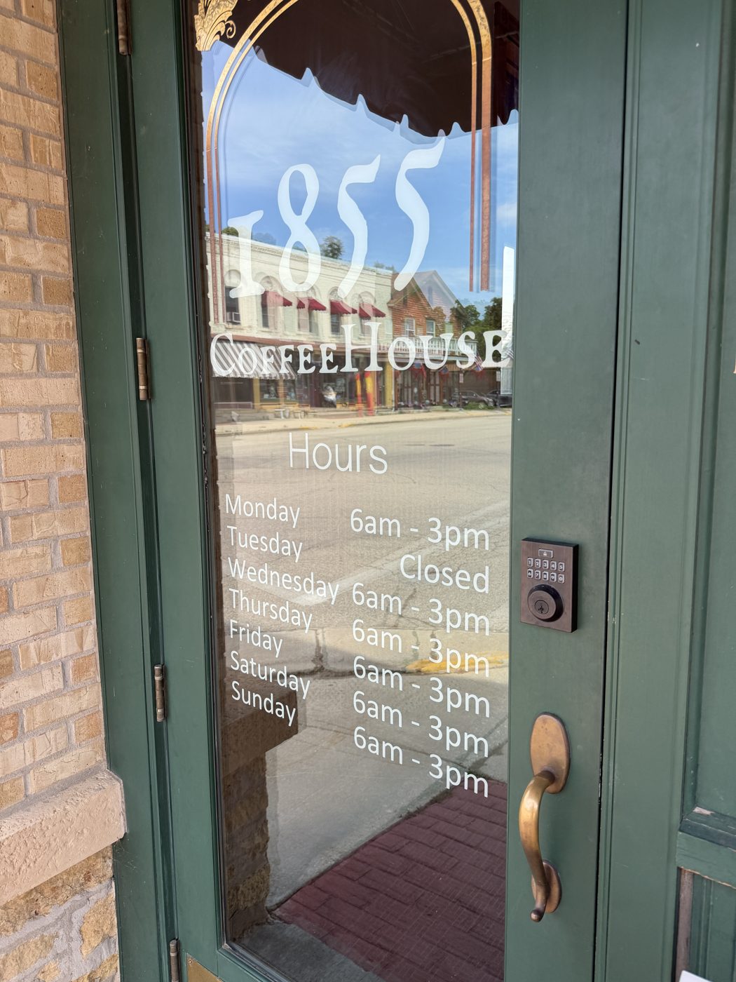 1855 Coffee House lettering and hours on the door